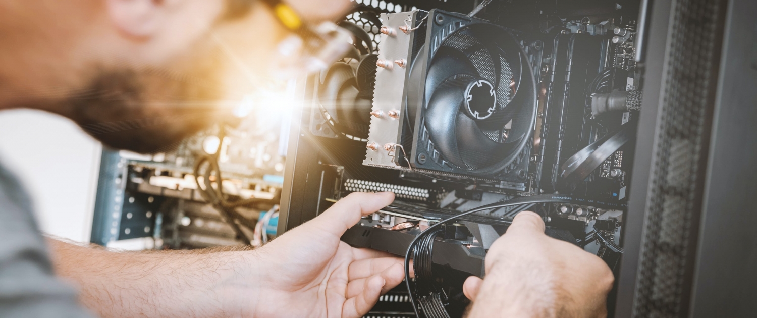 A person replaces a part inside of their computer.